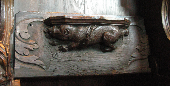 A misericord (mercy seat) in the Tunstall Chapel. This one shows chained bear, probably referring to the pastime of bear-baiting. Misericords are a wealth of information about the pastimes, myths and popular of medieval England. 